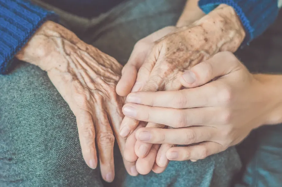 Senior woman smiling at home with caregiver in North Vancouver